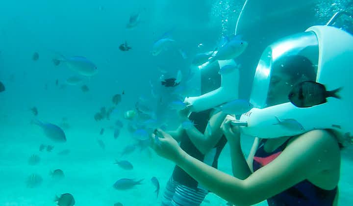 Tourists with Tropical Fish during Aquanaut Helmet Diving in Boracay