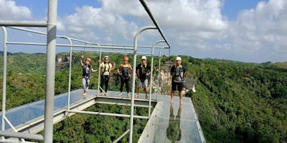 Tourists partaking in the Cliff-Glass Walk at Danao Adventure Park