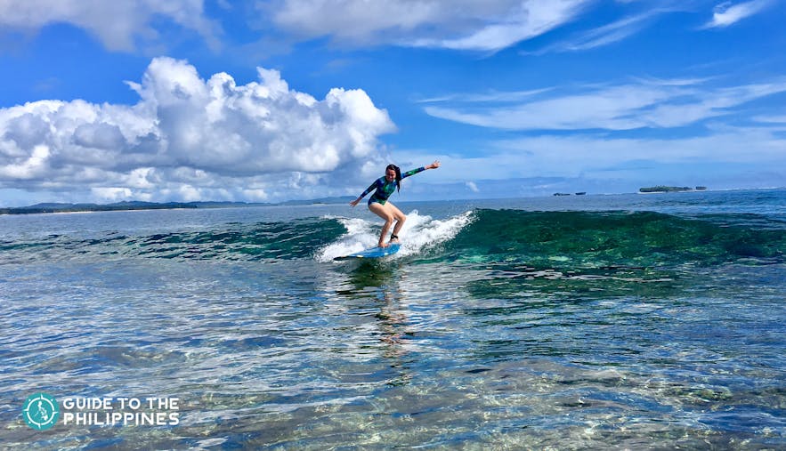 Girl during surfing season in Siargao, Philippines