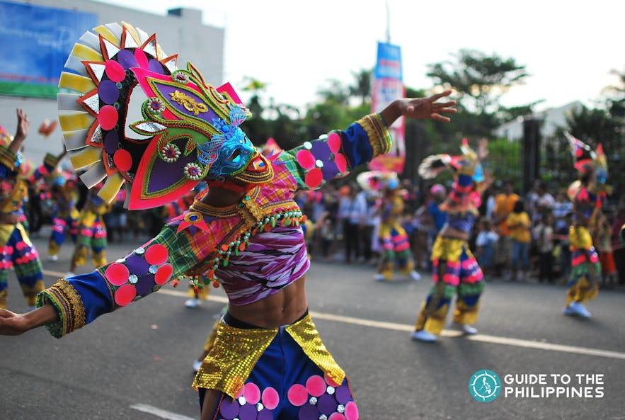 Participant of MassKara Festival street dance parade.