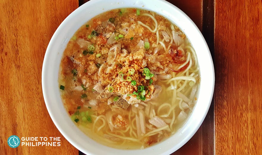  La Paz Batchoy, a clear noodle soup with pork cracklings, beef, chicken stock, and round noodles