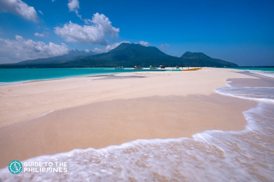 White sand and clear waters of White Island in Camiguin