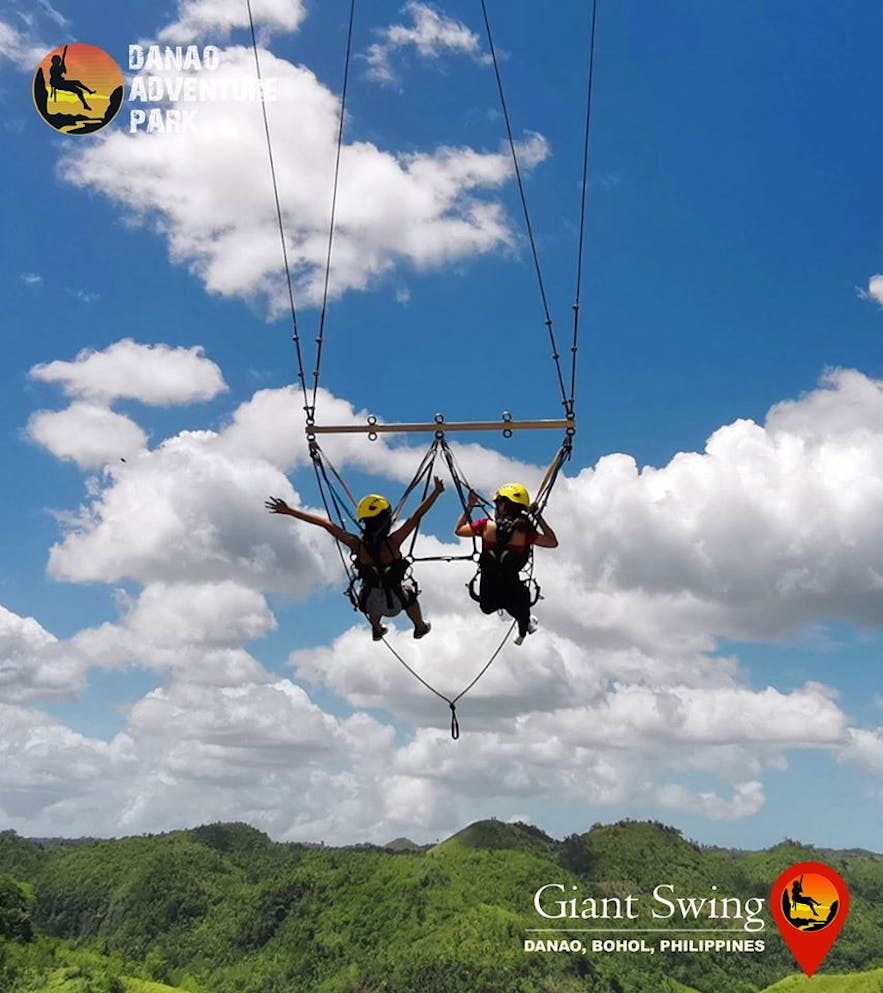 Female travelers enjoying the Giant Swing at Danao Adventure Park in Bohol, Philippines