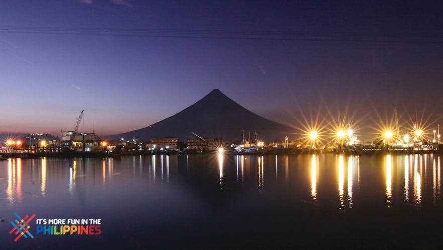 View of the Embarcadero de Legazpi with the silhouette of Mt. Mayon at night