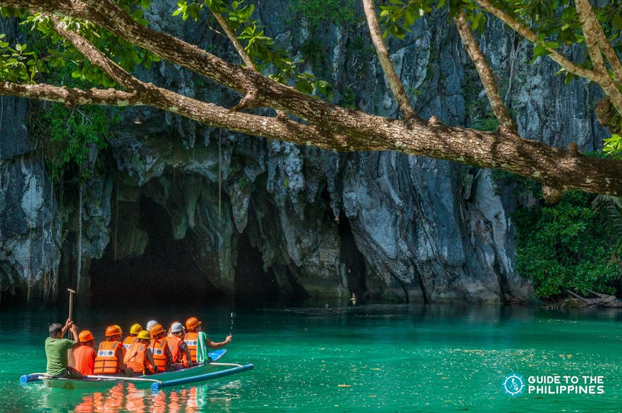 Travelers' boat going into the Underground River in Puerto Princesa, Palawan
