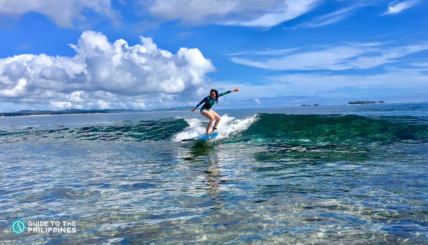 Girl surfer learning to surf