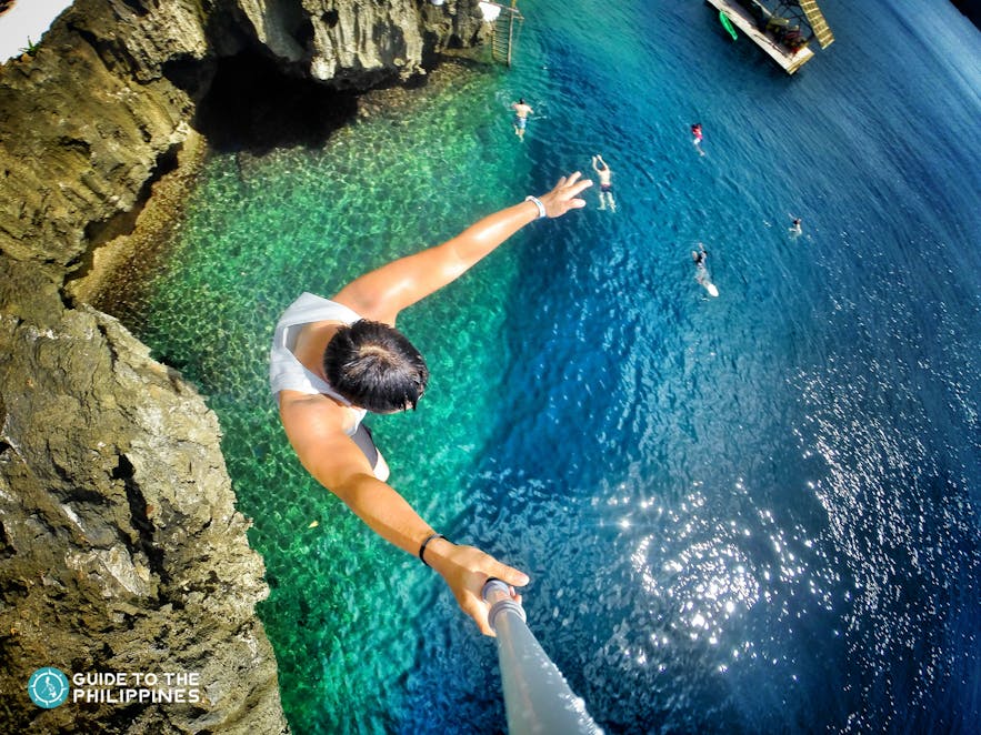 Man cliff-diving at Ariel's point