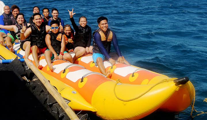 Family group enjoying banana boat ride at Boracay Beach