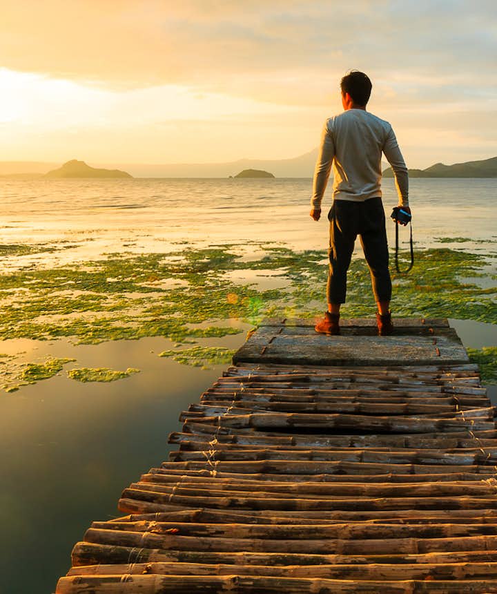 Man photographer looking at Taal Lake, Tagaytay