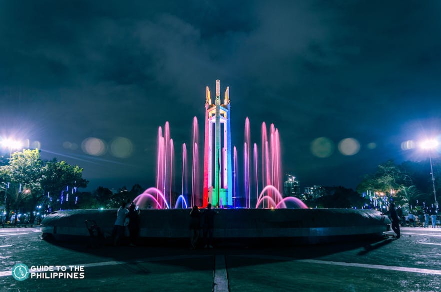 Dancing fountain and light show in Quezon City Memorial Circle at dusk