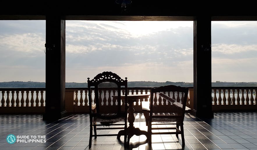 Silhouette of a chair overlooking the mountains at the Malacañang of the North