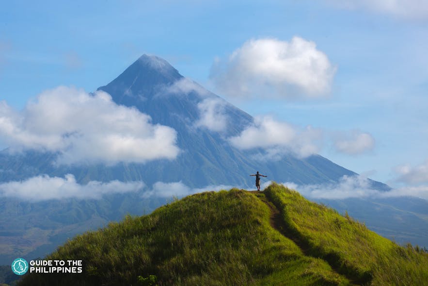 Hiker overlooking Mt. Mayon in Legazpi, Albay Philippines