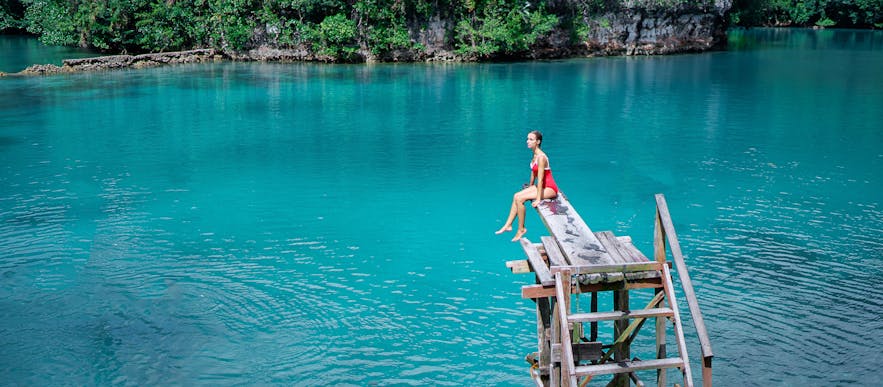 Woman traveler enjoying Sugba Lagoon in Siargao, Philippines