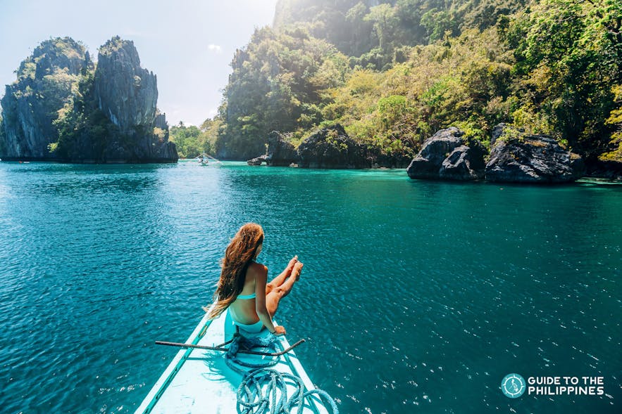 Woman traveler enjoying island hopping in El Nido, Palawan, Philippines
