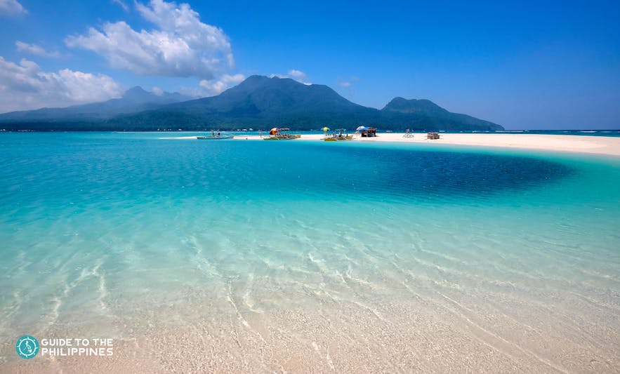 Fine sand and clear blue waters in Camiguin Island