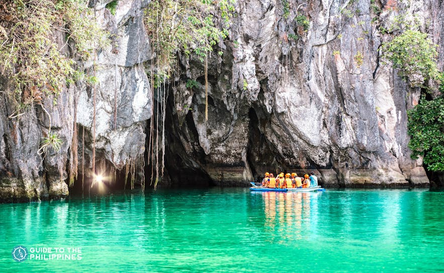 Travelers on a boat going into the Underground River in Puerto Princesa, Palawan