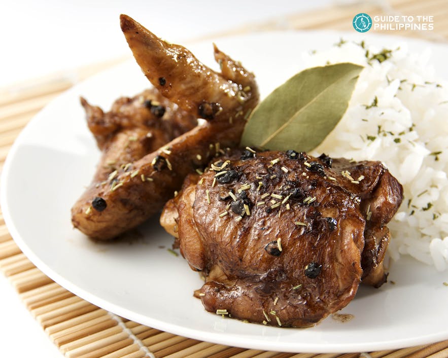 Iconic Chicken Adobo braised in vinegar, peppercorns, and bay leaves