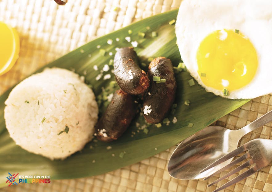 Longganisa with egg and fried rice for breakfast in the Philippines