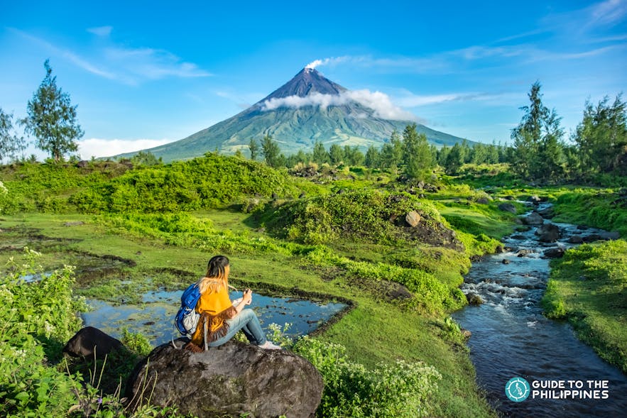 A girl looking at the wonderful view of Mayon Volcano