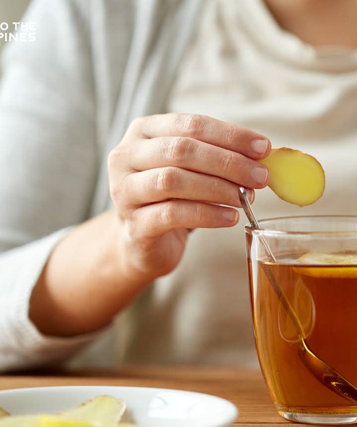Woman drinking a cup of ginger tea