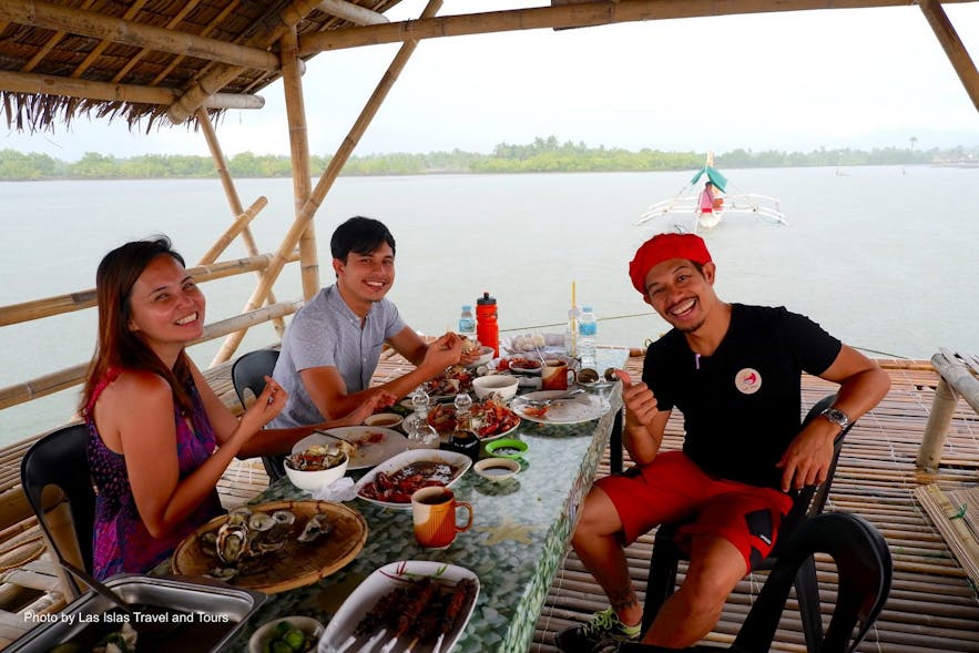 People eating in a floating restaurant in Capiz