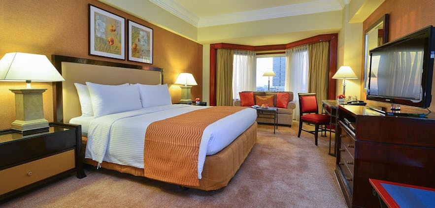A bedroom of the 5-star Diamond Hotel Manila