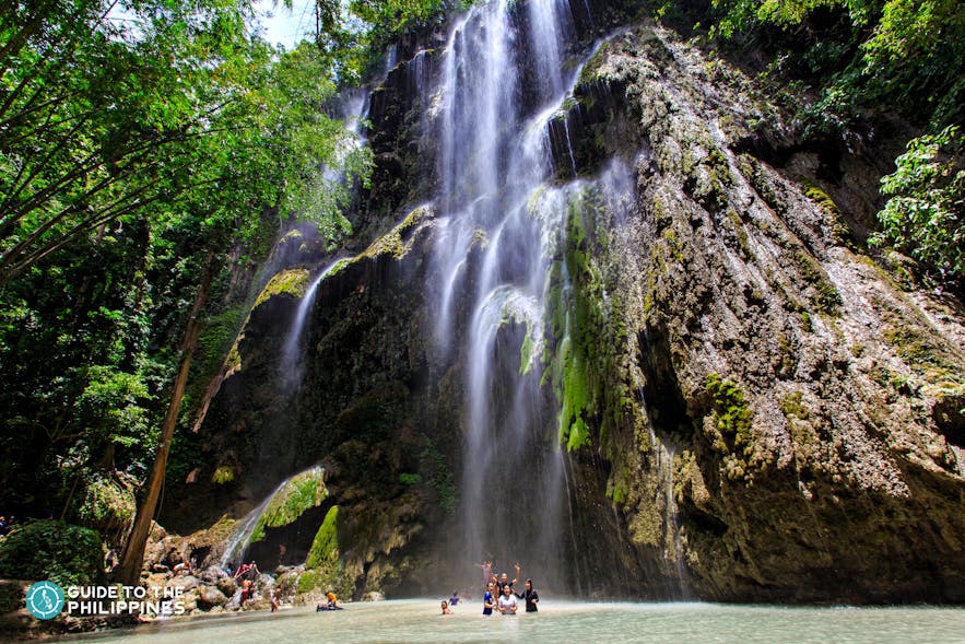 People enjoying Tumalog Falls in Oslob Cebu