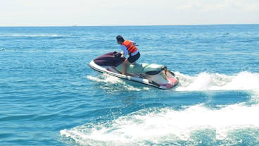 A guy while riding a jetski in Boracay