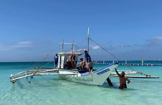 Divers riding a boat going to a dive spot in Boracay