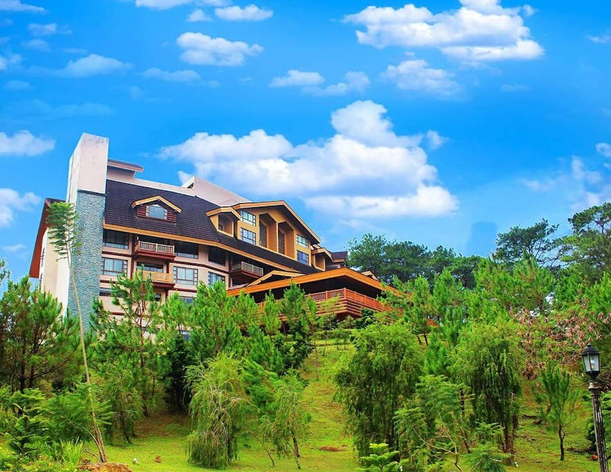 Green landscape surrounding The Forest Lodge at Camp John Hay