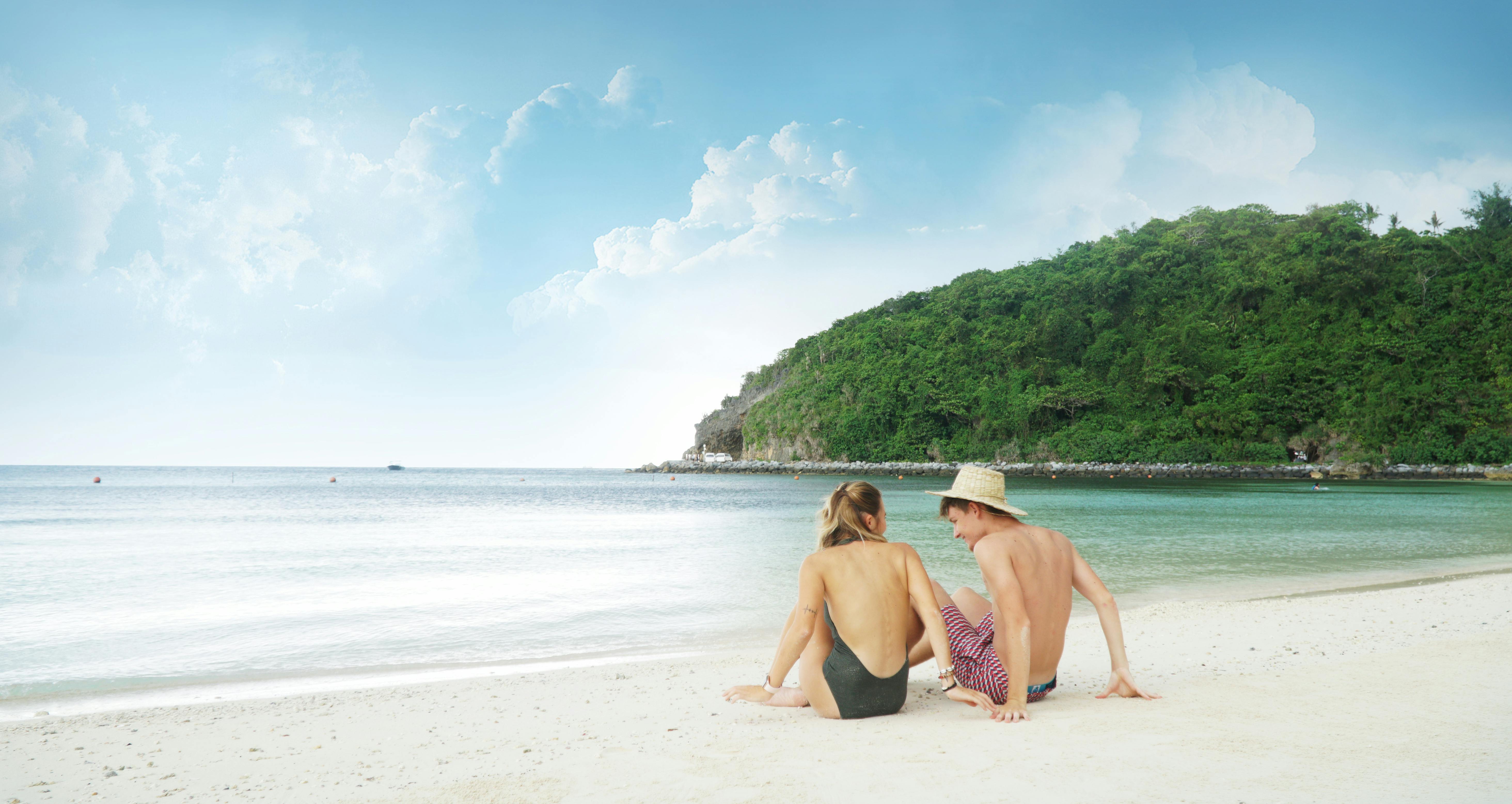 Couple enjoying the private beach of Bluewater Resort