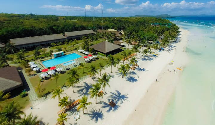 Aerial view of Bohol Beach Club Resort showcasing the pool, and wide private beach