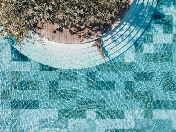 Woman in a pool of Amorita Resort
