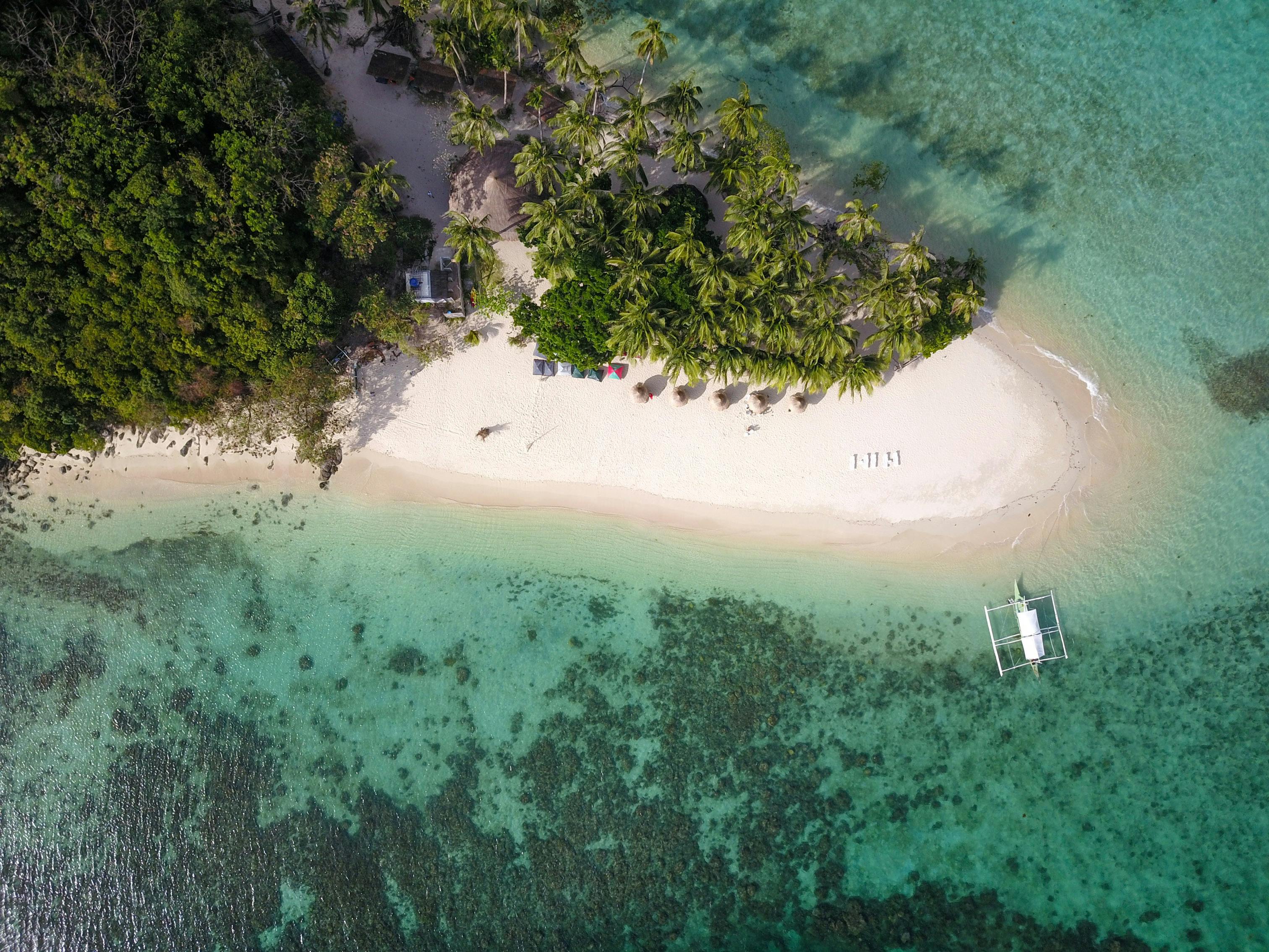 White sand beach of Inaladelan Island in Port Barton Palawan