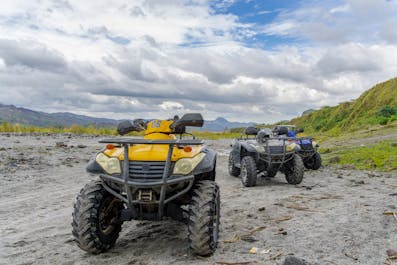 4x4 trucks parked at the foot of Mount Pinatubo