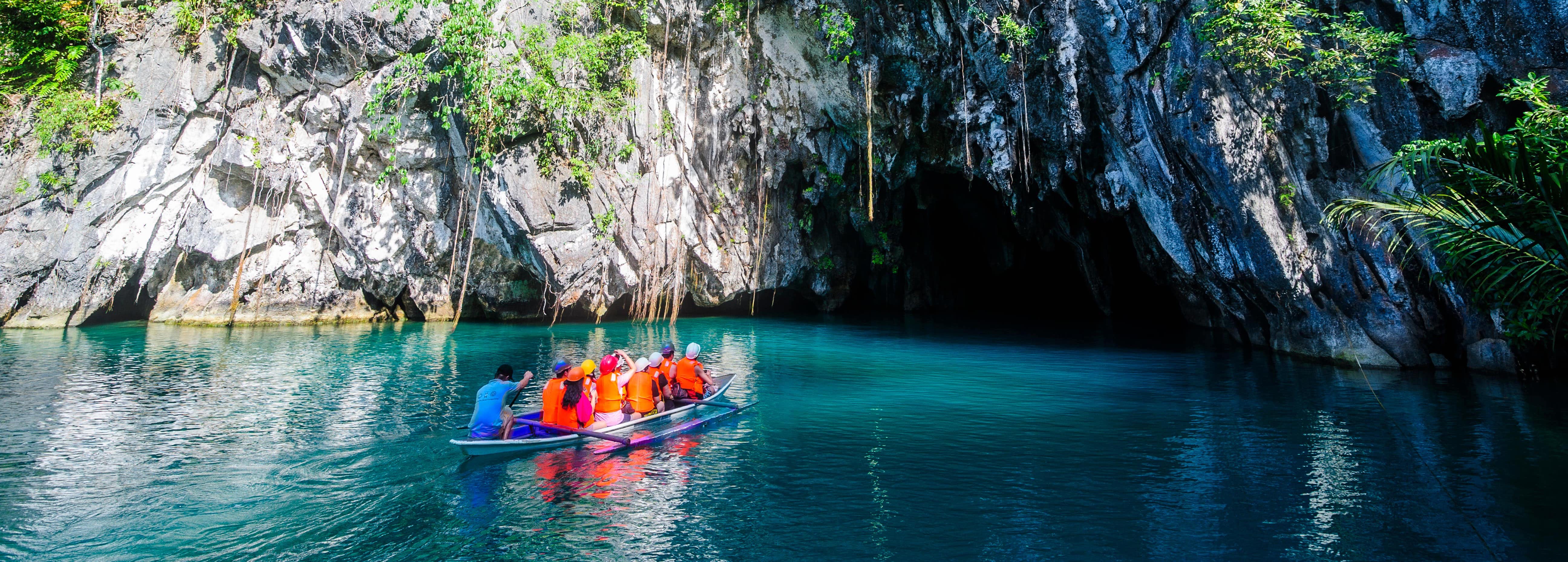 A boat full of tourists exploring Puerto Princesa Underground River