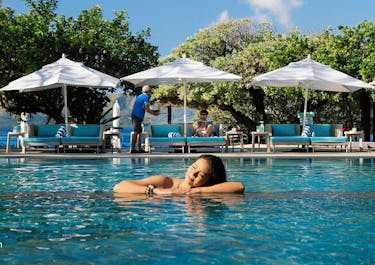 Woman enjoying the freshwater of Club Paradise Resort Pool