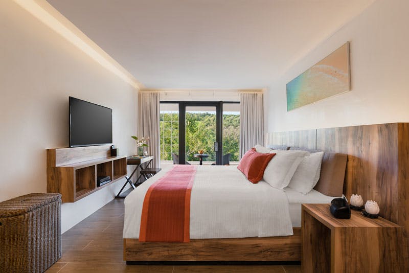 King-sized bed of Garden Suite at Club Paradise Resort