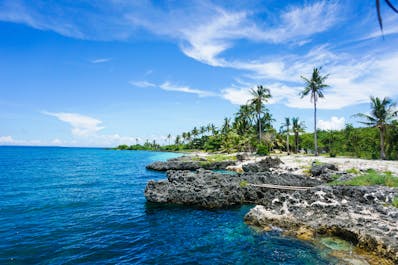 A cliff where tourists jump to swim in the clear blue waters of Bantayan Island