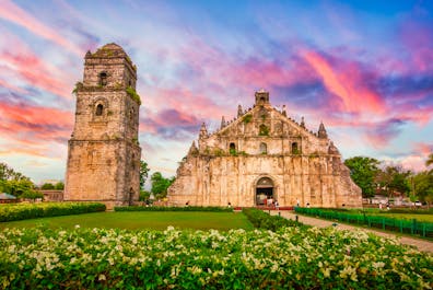 Enchanting facade of Paoay Church against the colorful sunset in Ilocos Norte
