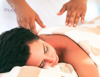 Woman enjoying a massage at The Muse Hotel