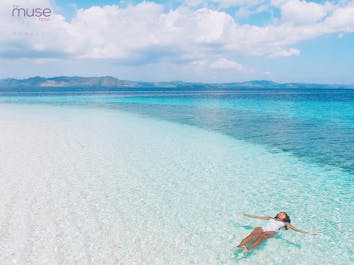 A girl enjoying the clear blue waters of Boracay