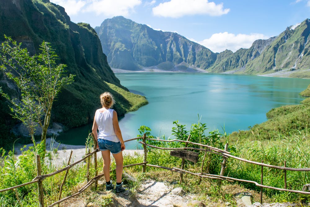 A tourist enjoying the view of Mount Pinatubo Crater Lake