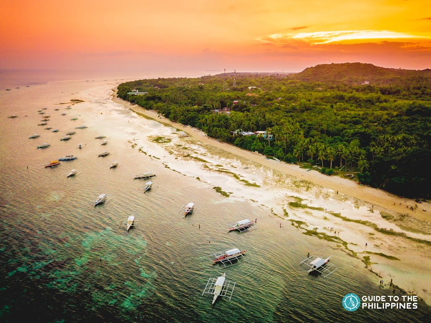 Sunset over the white-sand beach in Panglao