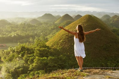 A girl enjoying the view of Chocolate Hills in Bohol