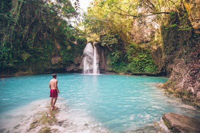 A tourist in Kawasan Falls, Cebu