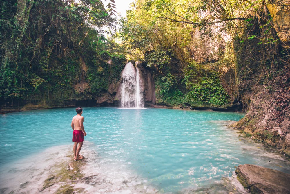 A tourist in Kawasan Falls, Cebu