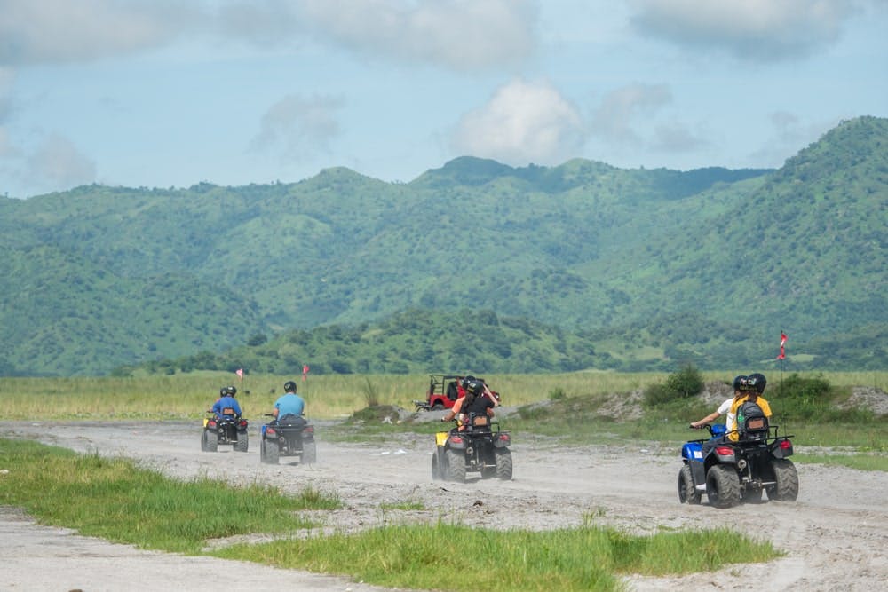 Tourists exploring Mt. Pinatubo in a 4x4 ATV ride