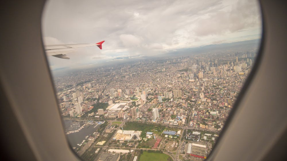Window seat view in an airplane going to Manila