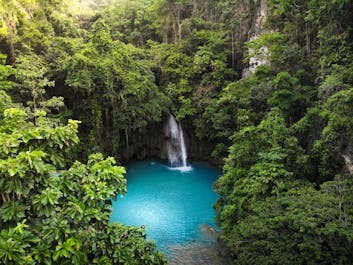 Blue waters of Cebu's popular Kawasan Falls